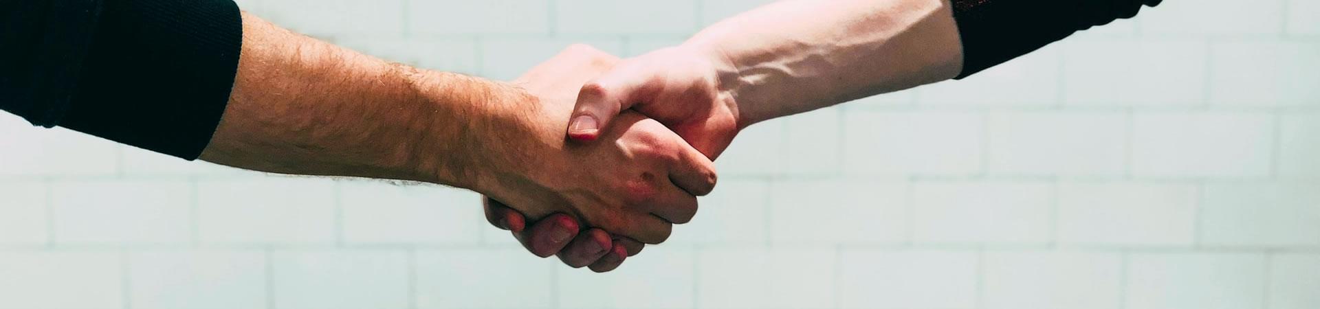 Employer and new employee shaking hands