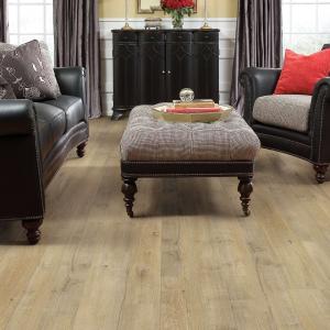Room scene with Castle Ridge laminate flooring by Shaw, in Forge