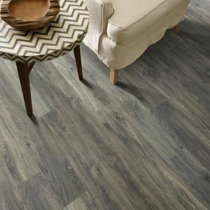Room scene with Cades Cove laminate flooring by Shaw, in Burleigh Taupe
