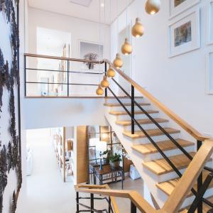 Room scene with stylish and modern wooden stairway