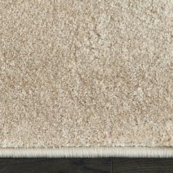 Custom-bound beige area rug with machine-serged edges