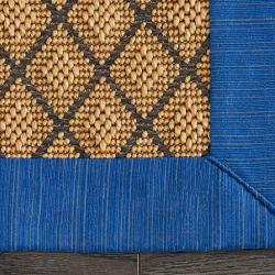 Custom-bound sisal area rug with fabric-bound edges and mitred corners