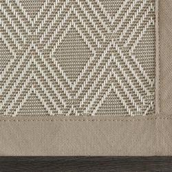 Custom-bound sisal area rug with fabric-bound edges and folded corners
