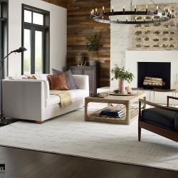 Room scene with custom-bound textured white area rug
