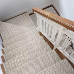 Stairs with herringbone-patterned stair runner