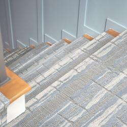 Stairs with blue-grey textured carpet stair runner