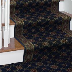 Victorian-style black carpet with red and gold floral pattern and matching stair runner