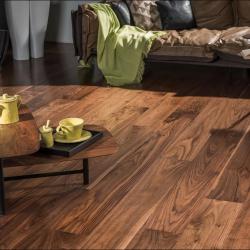 Warm brown hardwood floor with wide planks, in cozy living room scene