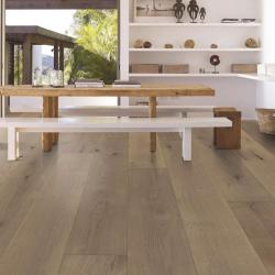 Honey brown, wide-plank hardwood floor in modern dining room scene