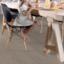 Medium taupe hardwood floor in family dining room scene