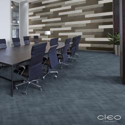 Boardroom scene with stone tile accent wall and dark blue  limestone composite flooring