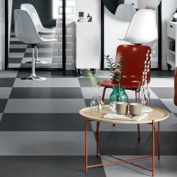 Room scene with luxury vinyl flooring in black and light grey checkerboard pattern