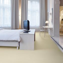 Bedroom scene with pale gold Marmoleum flooring