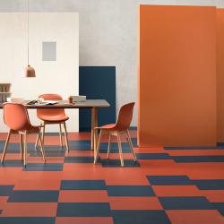 Room scene with bold Marmoleum flooring in red-orange and navy blue
