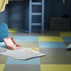 Room scene with Marmoleum floor in alternating soft blues and greens