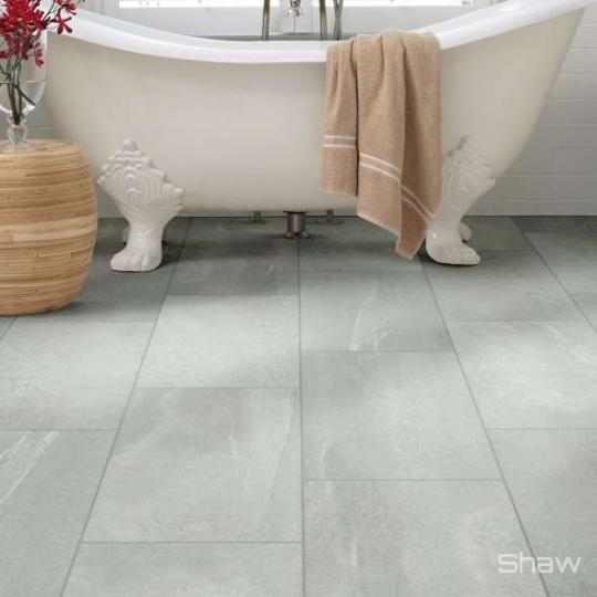 Bathroom scene with Sculpture porcelain tile by Shaw, in Grey