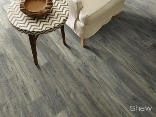 Room scene with Cades Cove laminate flooring by Shaw, in Burleigh Taupe