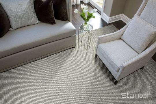 Room scene with Ancestry jute-blend carpet by Stanton, in Steel