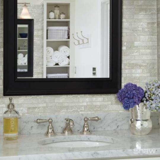 Bathroom scene with Rio Random Linear Mosaic stone tile from Shaw, in Ritz Grey